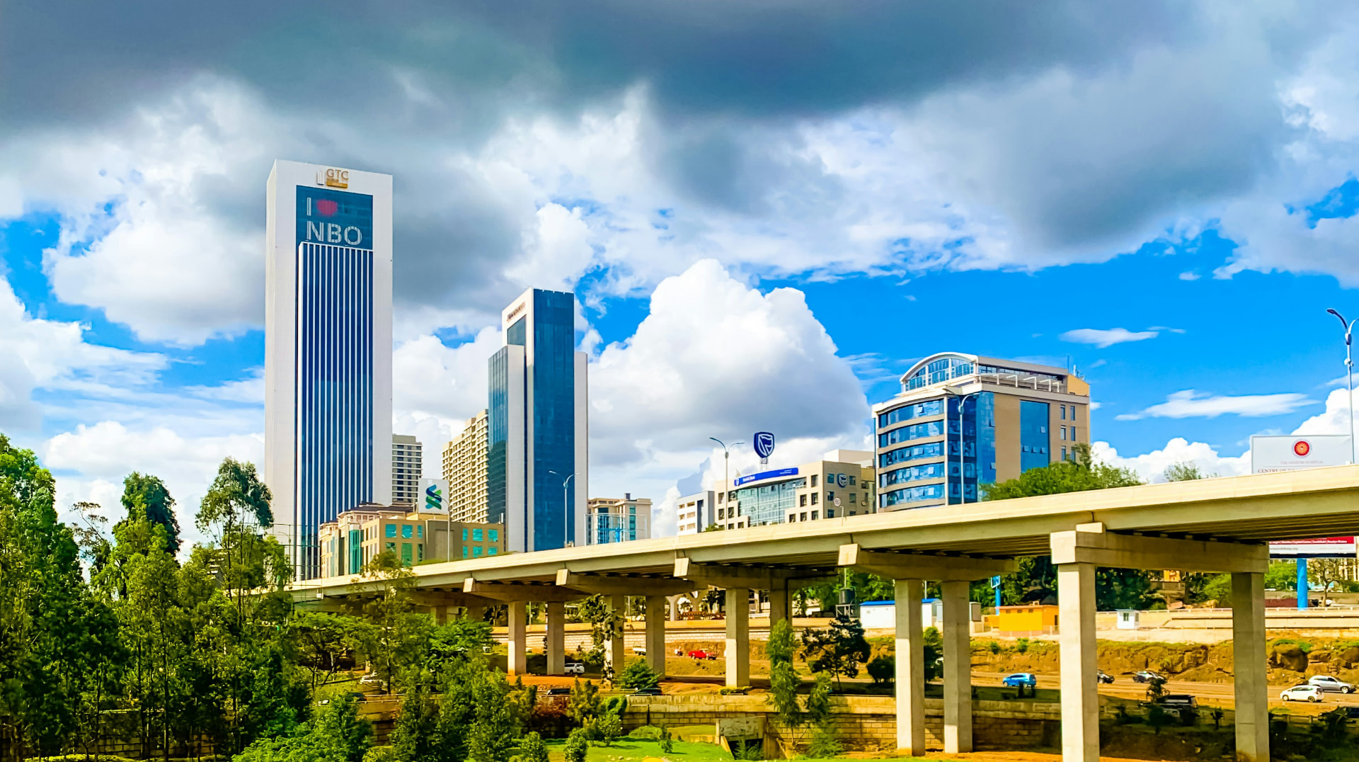 Nairobi skyline and expressway under a blue sky